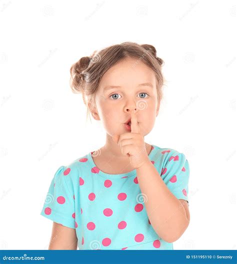 Cute Little Girl Showing Silence Gesture On White Background Stock
