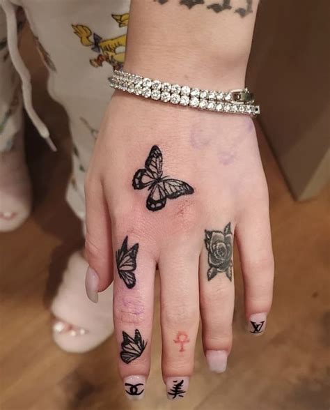 Summers are back and heat is on. bhad bhabie 🦋 | Hand tattoos for girls, Hand tattoos for ...