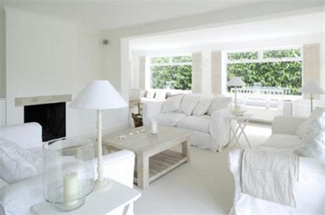White guest room with geometric mirror. 15 Serene All White Living Room Design Ideas - Rilane