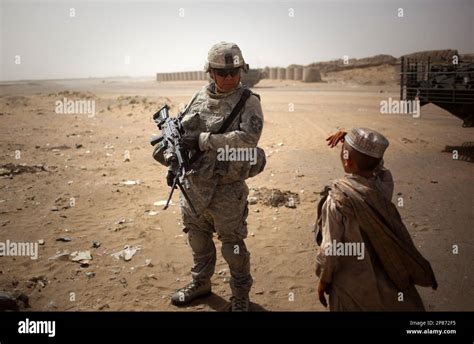 An Afghan Boy Is Seen Next To Private First Class Us Soldier Ryan