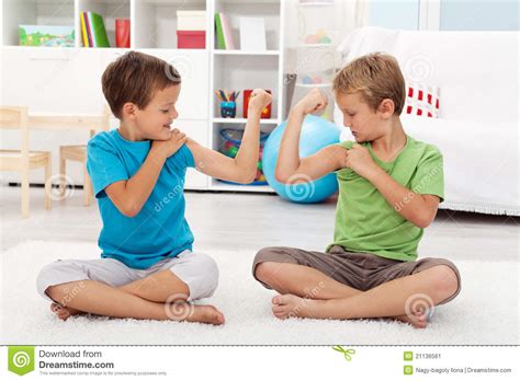 Boys Showing Off Their Muscle Stock Image - Image of laughing, show ...