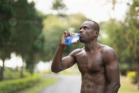 Attractive African Sport Man Tired And Thirsty After Running Workout