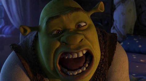 An Animated Green Man With His Mouth Open And Teeth Wide Open In A
