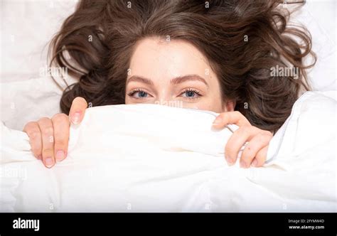 Woman Hiding Under Blanket Stock Photo Alamy