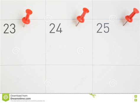 Red Pins Pinned On The Dates Of The Month On Calendar Paper Stock Image