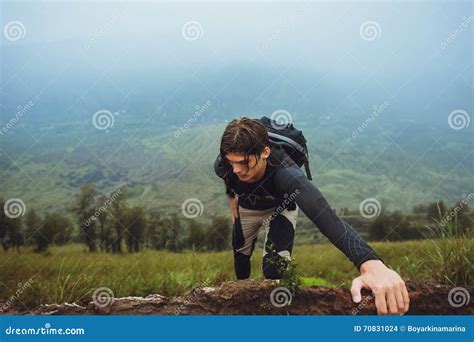Hiker Man Climbing A Steep Wall In Mountain Stock Photo Image Of