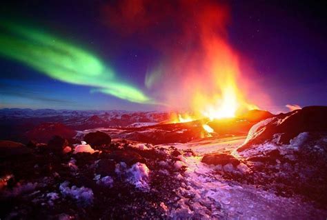 Aurora Borealis Northern Lights And Erupting Volcano In Iceland R