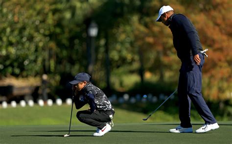 Look Photo Of Tiger Woods Caddying For His Son Goes Viral The Spun
