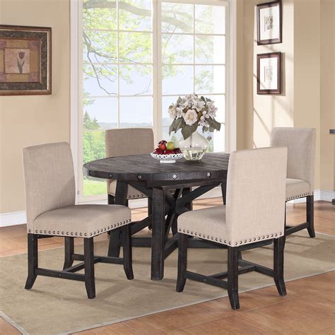 The metal dining chairs bring an industrial look to your space while giving you a comfortable place to sit whether you're having a quick breakfast or settling in for dinner. Modus Round Yosemite 5 Piece Round Dining Table Set with ...