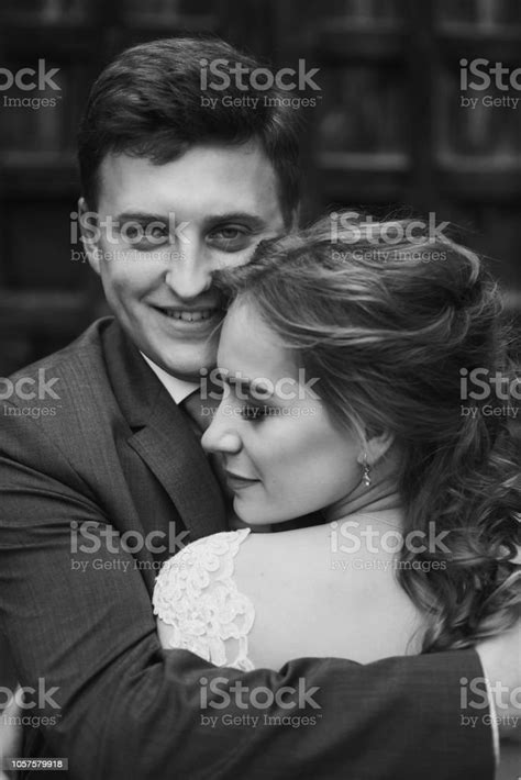 Beautiful Gorgeous Bride And Groom Kissing Happy Wedding Couple Hugging And Embracing Happy