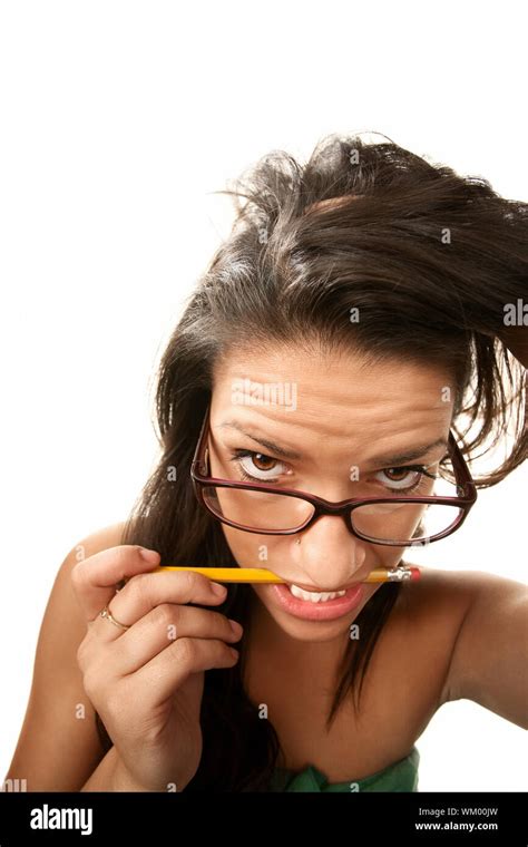 Nervous Hispanic Woman Chewing On A Pencil Stock Photo Alamy
