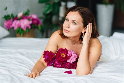 Attractive Topless Woman With A Bouquet Of Peonies On The Bed Stock Image Image Of Fragrances
