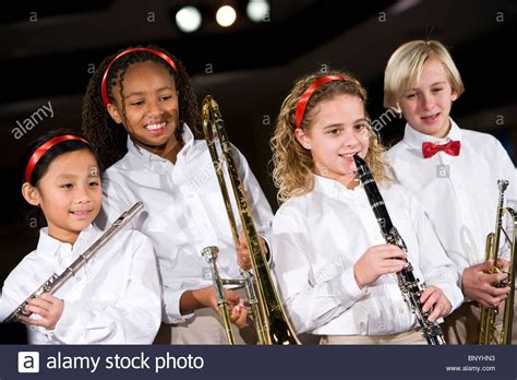 Stock Photo School Children Playing Musical Instruments In Band