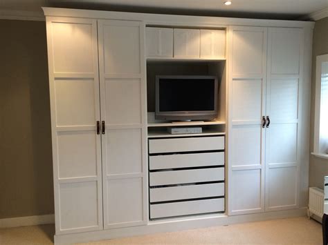Fitted wardrobes and bookcases in london. IKEA Pax wardrobes hacked to look built in. With leather ...
