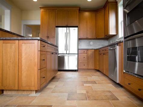 Her space features hexagon floor tiles, a rustic white wooden table contrasted with black metal chairs. Choose the Best Flooring for Your Kitchen | HGTV