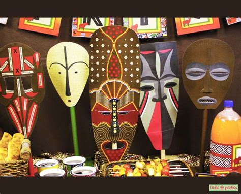 An africa party theme creates a great time for guests of any age or for any size event. Celebrate Africa Mask Centerpieces | African party theme ...