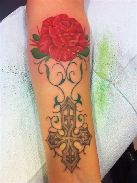 A vine tattoo is symbolic of strength, power and good luck. Cross Tattoo by Markus. Decided to expand tattoo- Rose and ...