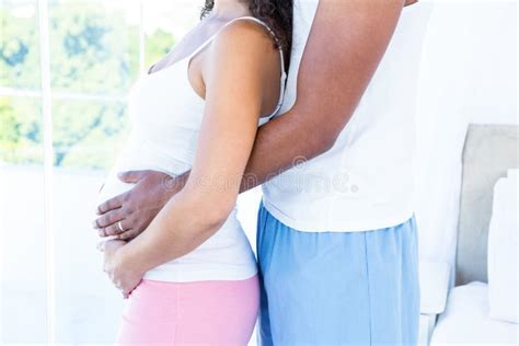 Husband Touching Pregnant Wife Belly While Standing Stock Image Image Of Couple Emotion 60540873