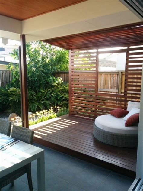 Outdoor Patio Area With An Extended Wooden Slatted Roof Side Wall And