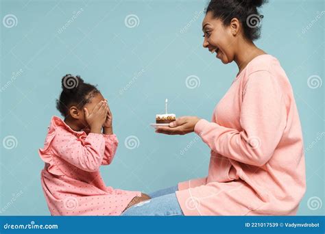 Happy Black Mother And Daughter Celebrating Birthday With Cake Stock