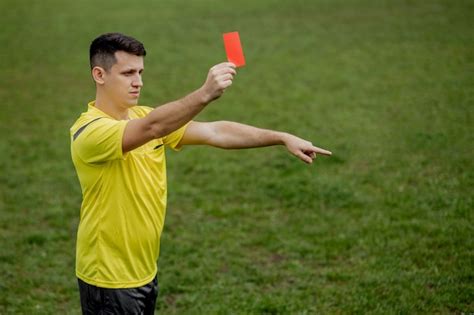 Premium Photo Angry Football Referee Showing A Red Card And Pointing With His Hand On Penalty