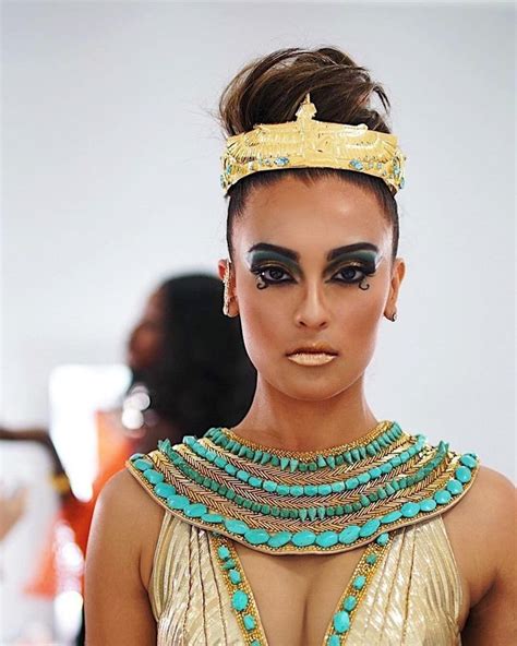 A Woman With Makeup And Jewelry On The Runway