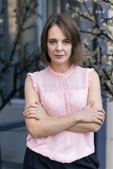 Portrait Of Thirty Year Old Woman With Bob Haircut In Pink Blouse Business Clothes Style Stock