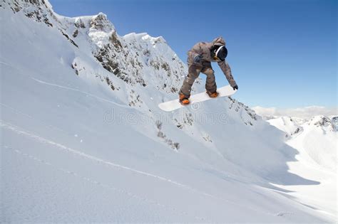 Snowboard Rider Jumping On Mountains Extreme Snowboard Sport Stock