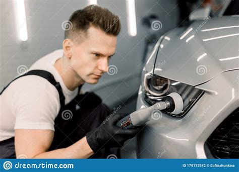 Detailing And Polishing Of Car Headlight On Car Young Professional