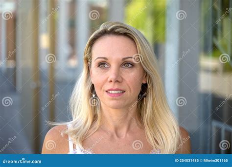 attractive mature blond woman with a quiet smile stock image image of expression casual
