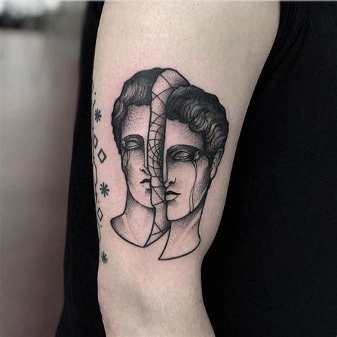 Divided Head Tattoo By Jonas Ribeiro Inked On The Right Arm Tiny