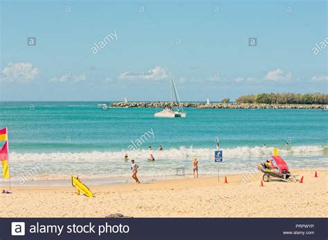 people enjoying a warm sunny day on the beach in mooloolaba one of queensland s premier holiday
