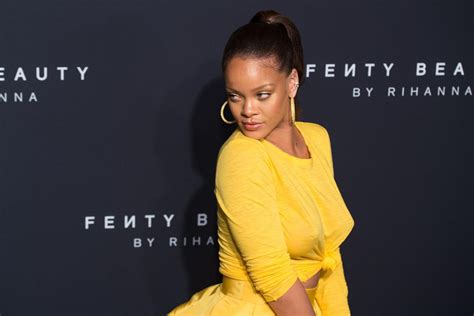 Rihanna Stuns In Yellow Dress As She Celebrates Fenty