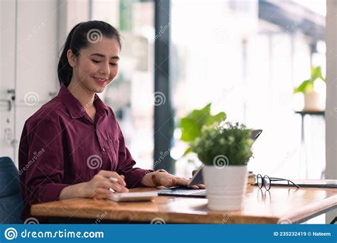 Charming Asian Female Accountant Or Banker Making Calculations Savings Finances And Economy
