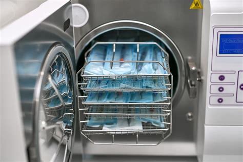Sterilize Machine With Opened Door And Dental Probes Inside Stock Image