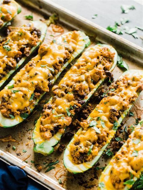 Looking for stuffed zucchini recipes? Stuffed Zucchini Boats with Ground Turkey - Dad With A Pan