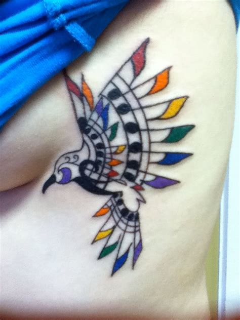 Music Bird Tattoo With Colored Flags Very Pretty Music Bird