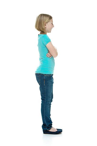 Little Girl Standing Sideways Stock Photos Pictures And Royalty Free