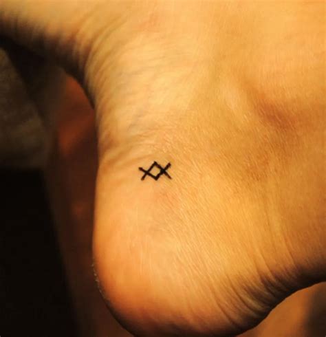 20 Tiny Tattoos With Big Meanings Small Symbol Tattoos Tiny Tattoos