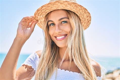 Young Blonde Tourist Girl Smiling Happy Looking To The Camera Walking