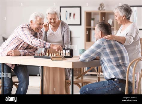 Elderly People Playing Chess In Nursing Home Stock Photo Alamy