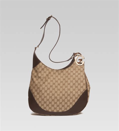 Shop the latest range of women's clothing and accessories. Gucci Charlotte Medium Shoulder Bag with G Detail in Black ...