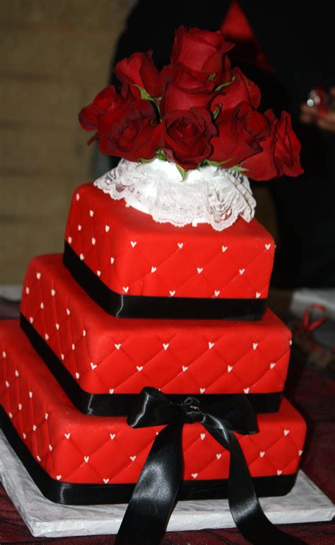 Quilted red fondant cake with black satin ribbon and white ...