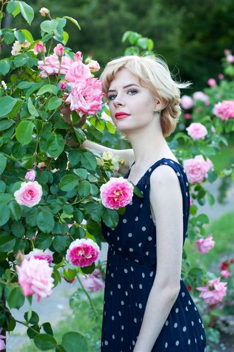 Beautiful Blonde Woman In Blue Dress Posing In Garden Stock Image Image Of Caucasian Hair