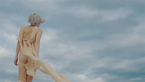 Half Naked Goddess Strolling Against Cloudy Sky Stock Footage Video