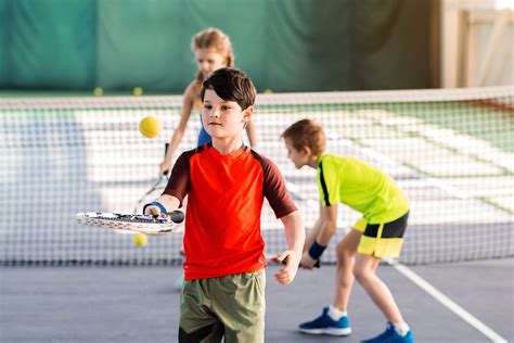 Carefree Kids Enjoying Playtime On Tennis Court King Daddy Sports