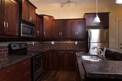Assembled cabinets by the manufacturer (not assembled rta) trying to picture these espresso cabinets with this granite and white tile back splash with ...