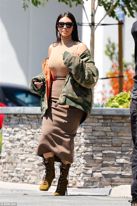 Kim Kardashian Squeezes Her Ample Assets Into A Skin Tight Bodysuit And Skirt Daily Mail Online