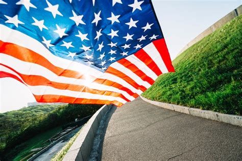 Free Photo American Flag With Road And Sunshine