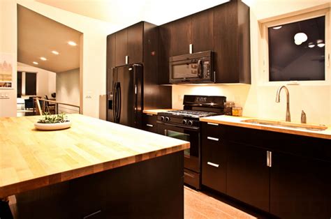 Navy blue kitchen island with butcherblock countertop and white cabinets. 22 Beautiful Kitchen Colors with Dark Cabinets | Home ...